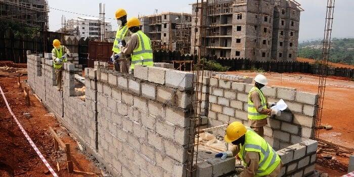 Image of construction workers on site constructing a house