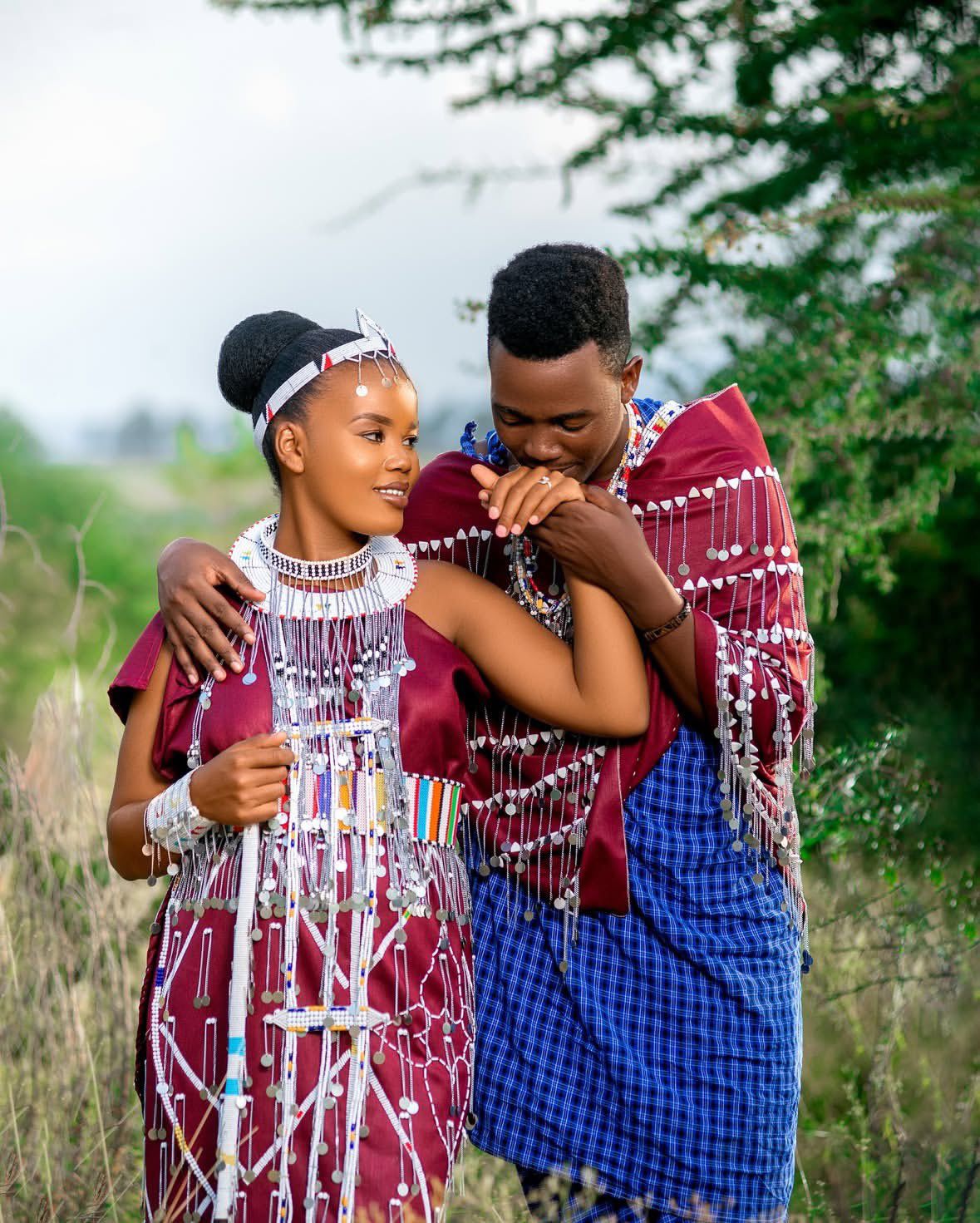 Couples standing together wrapped in a traditional Maasai shuka