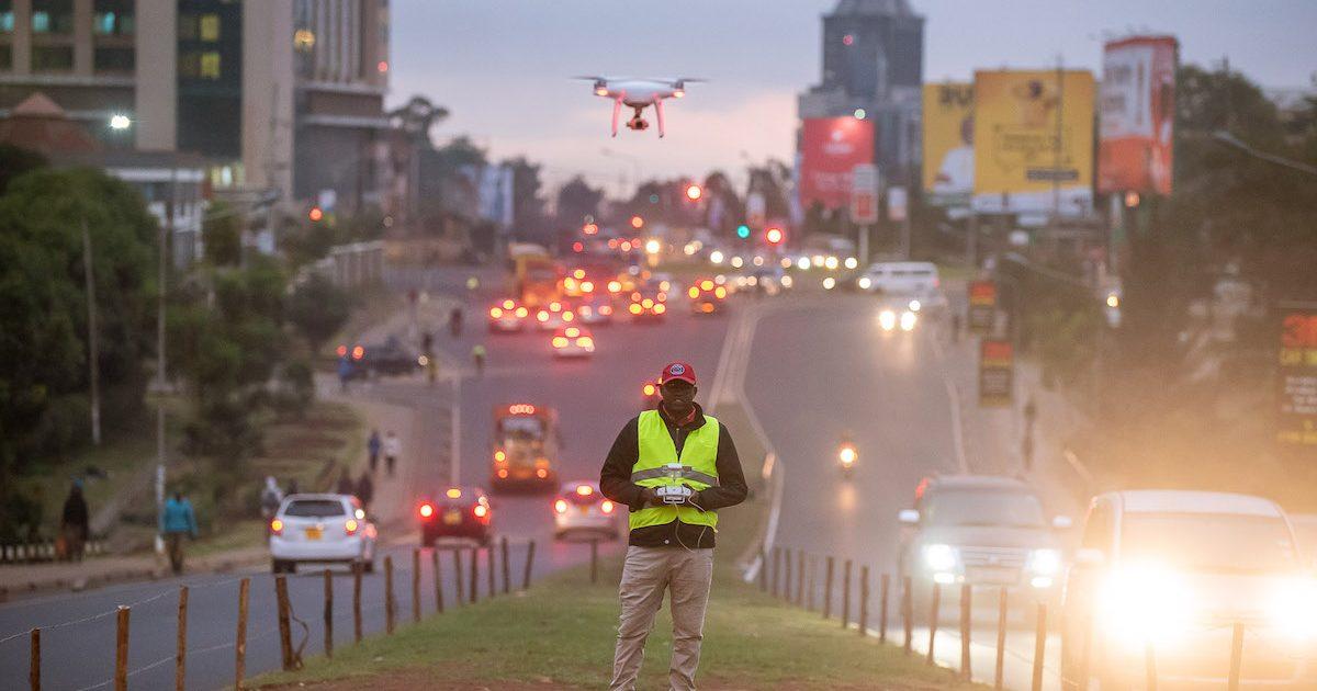 Image of a man taking aerial photography using a drone