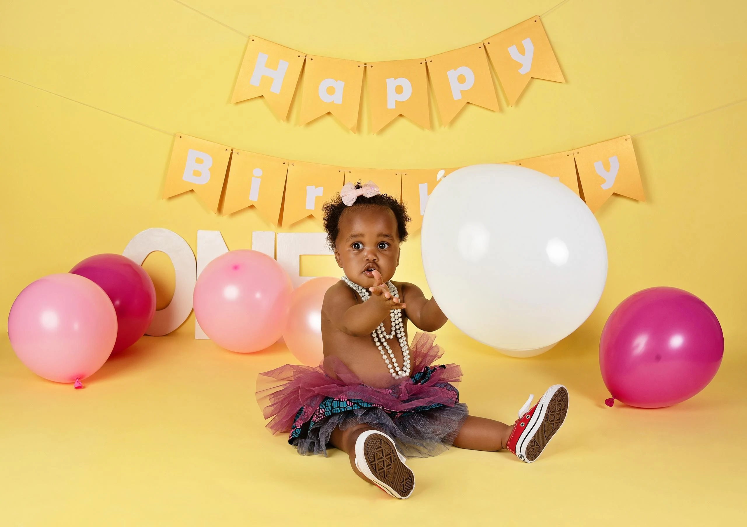 Professional cake smash photography session in Nairobi studio for a baby's first birthday