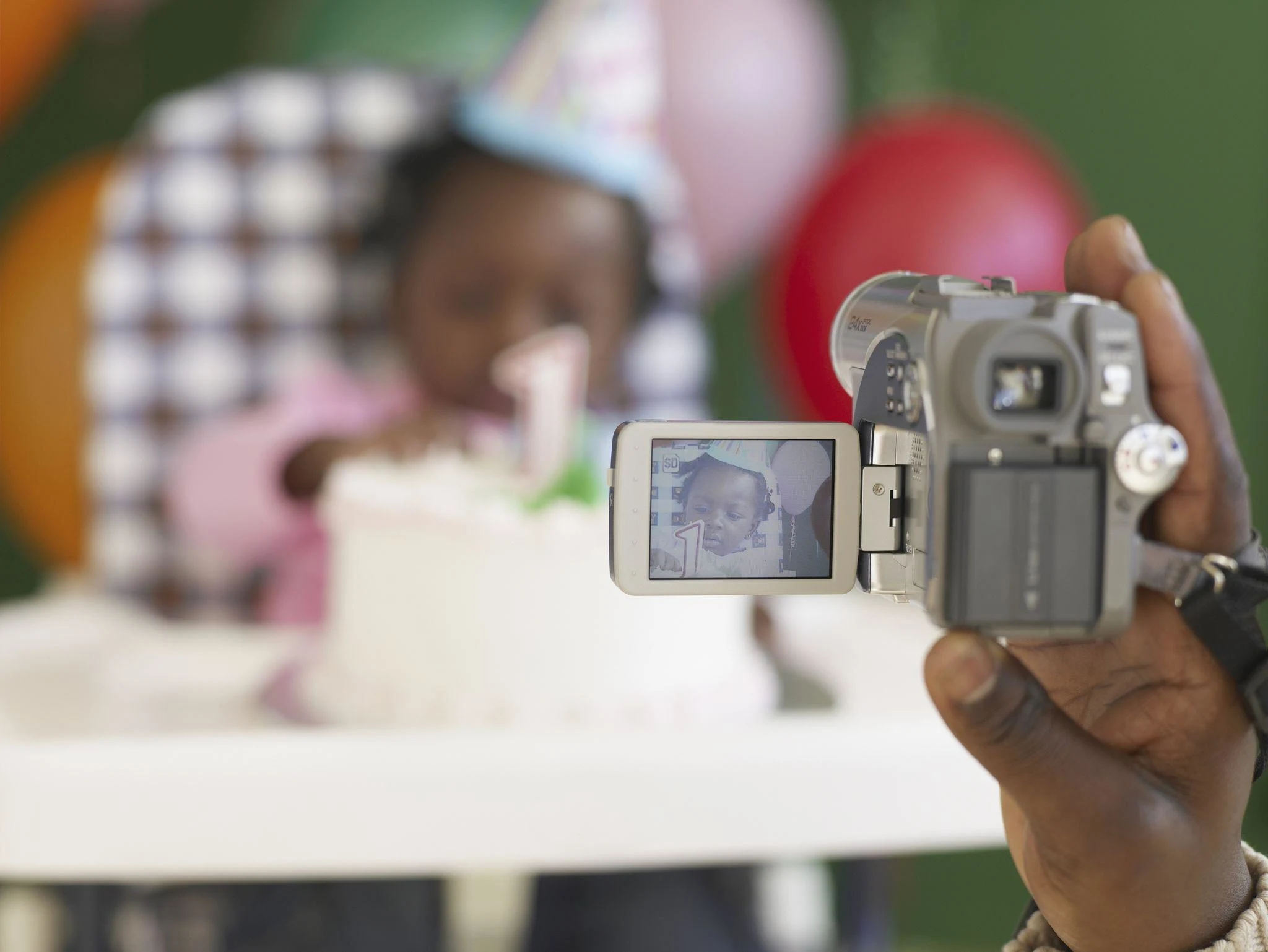 Videographer recording cake smash session for Instagram Reels and social media content