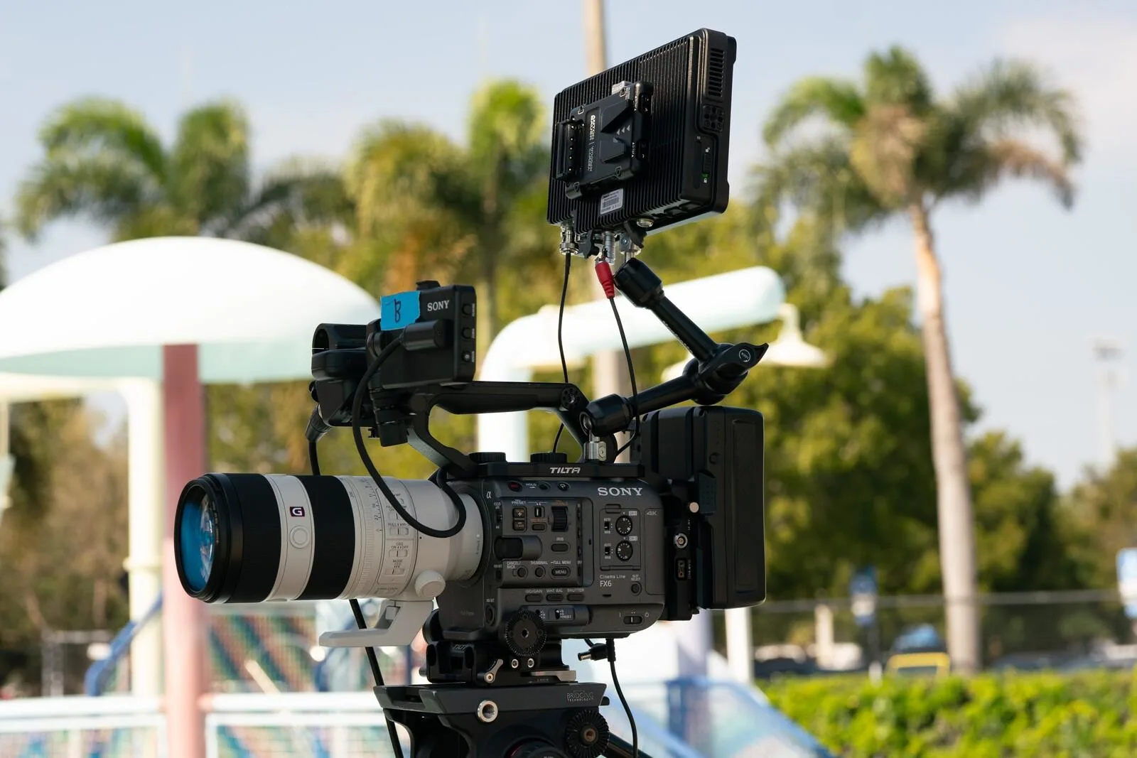 Cinema camera setup for professional commercial video production in Kenya featuring lighting and support equipment.