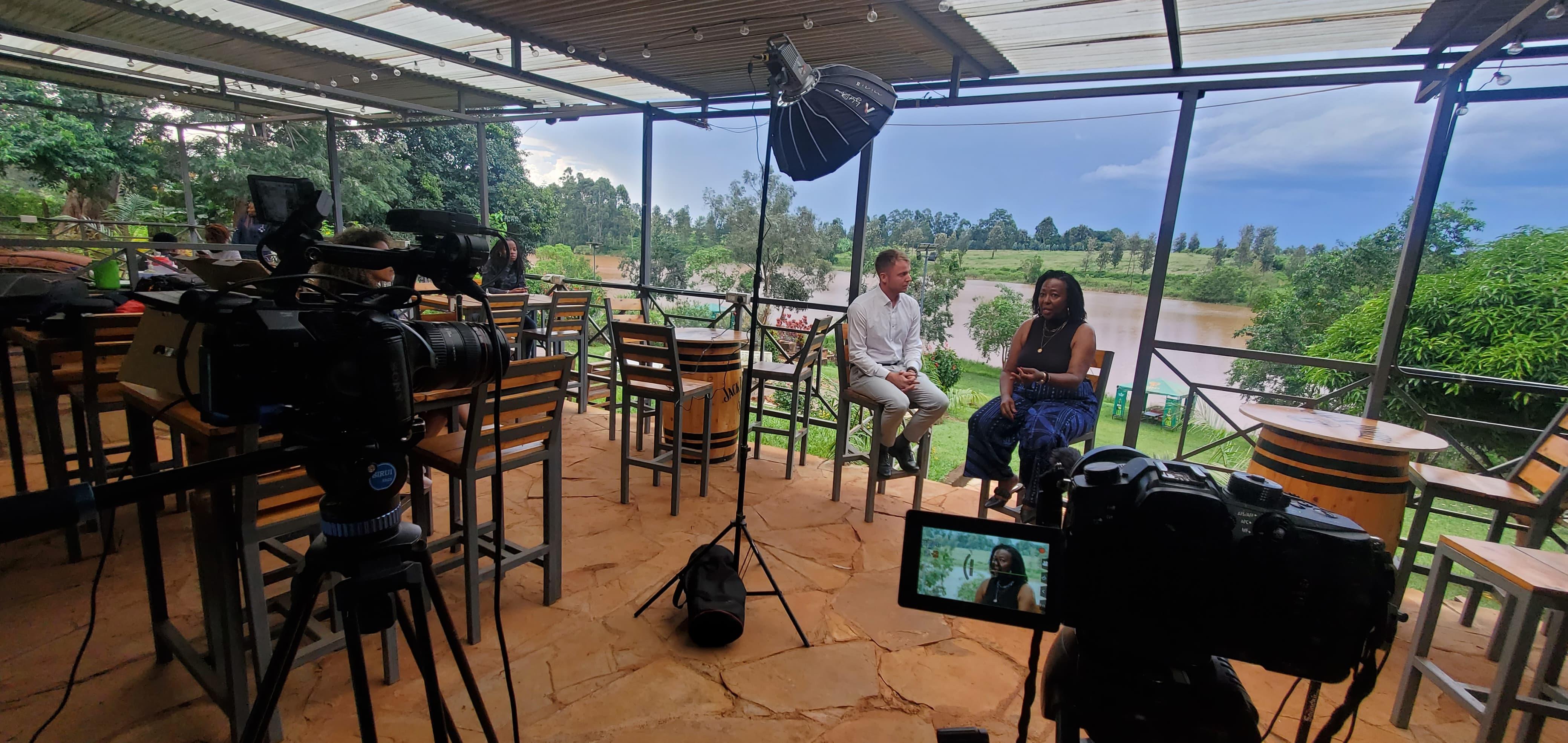 LED lighting panels and professional audio recording equipment on a commercial video production set in Kenya.
