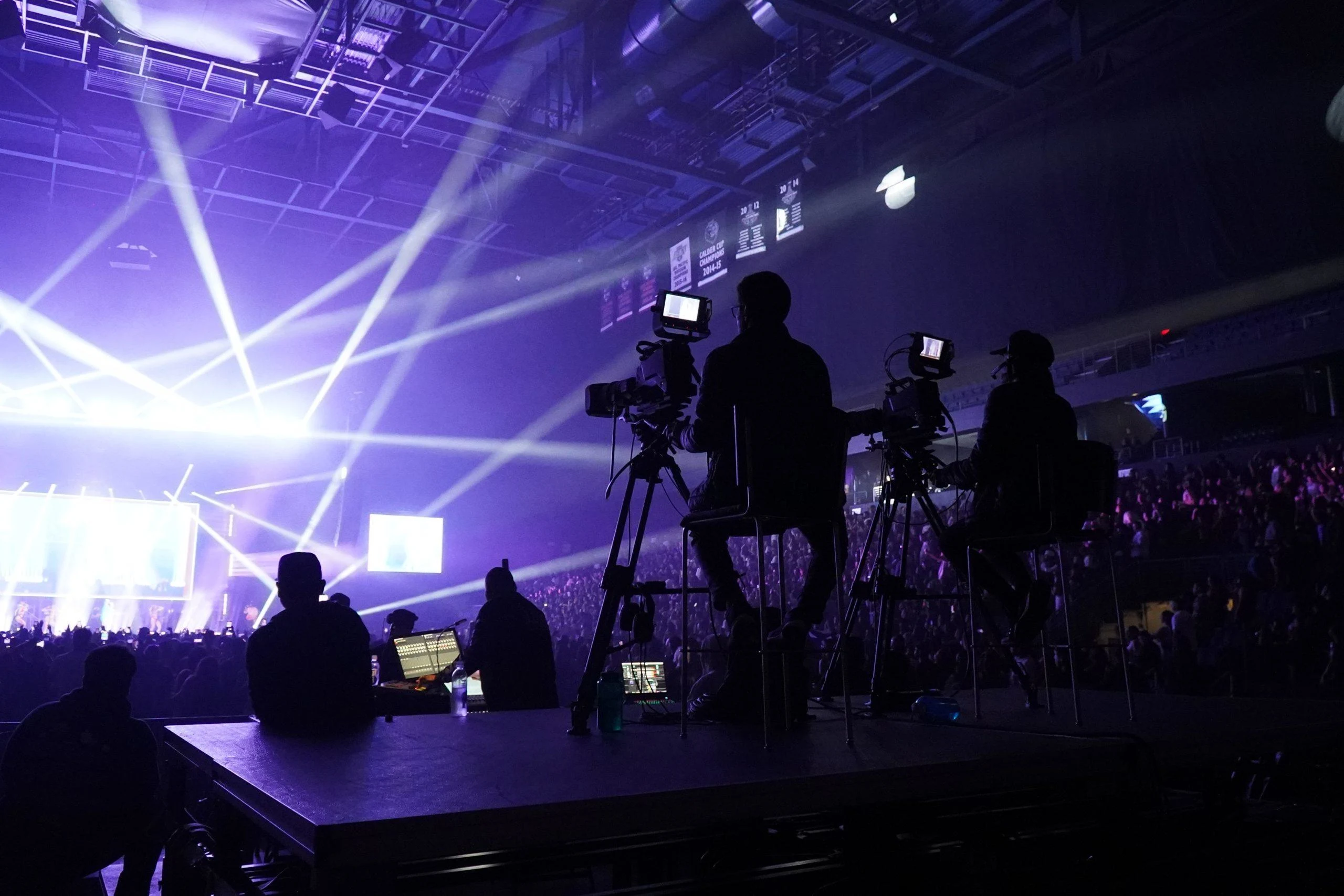 Technical video production team planning camera positions and stage coverage for a live concert in Kenya.