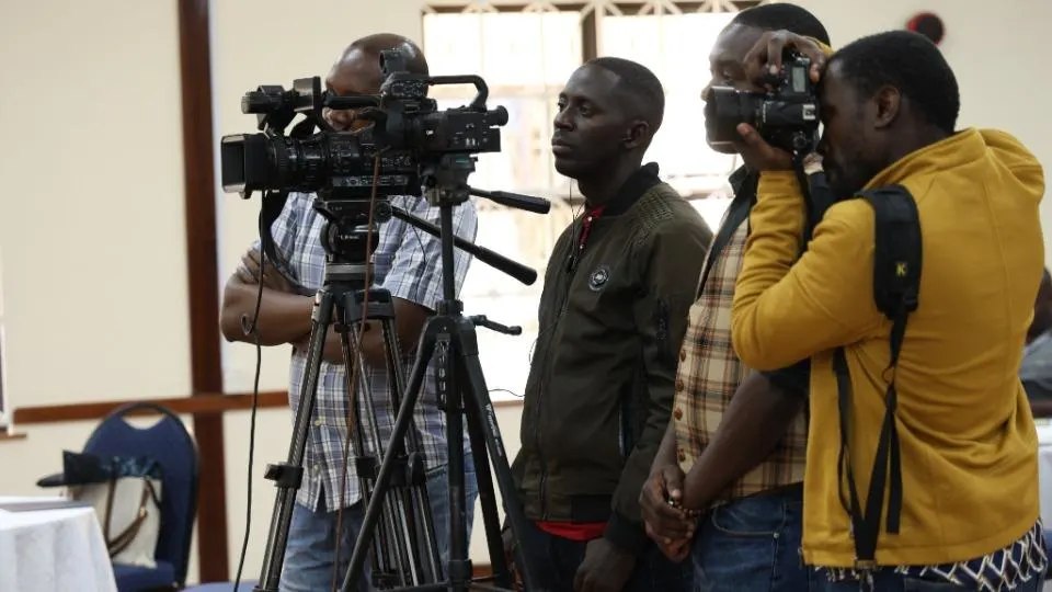 Photography production crew preparing equipment for event covera