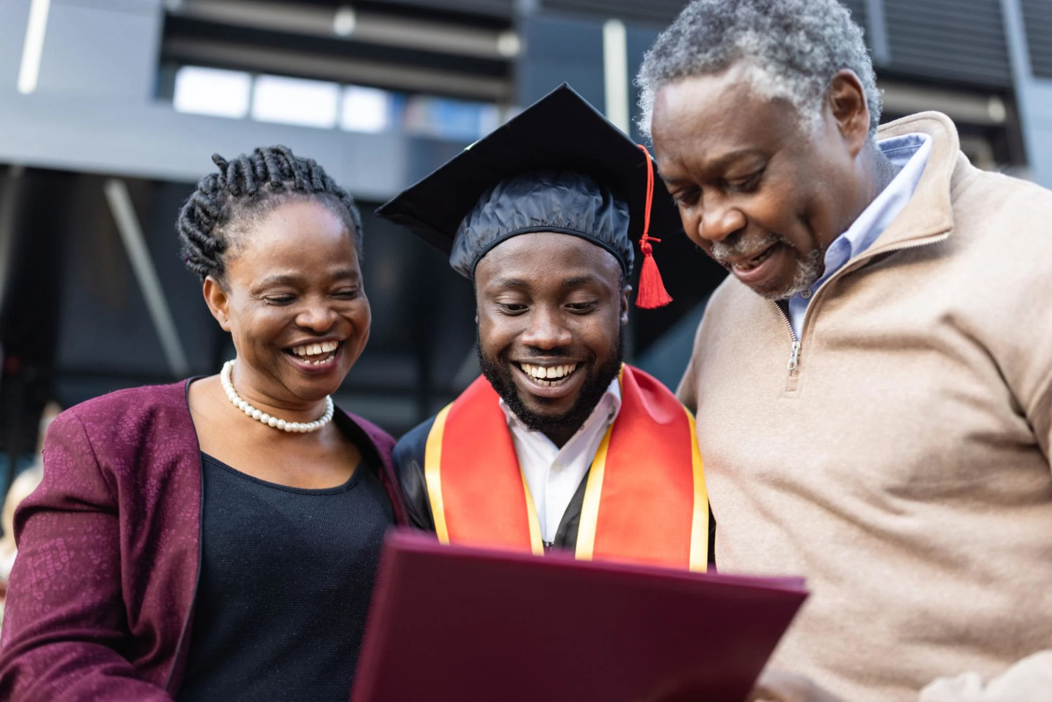 Graduate celebrating with family during a professional graduation photoshoot in Nairobi