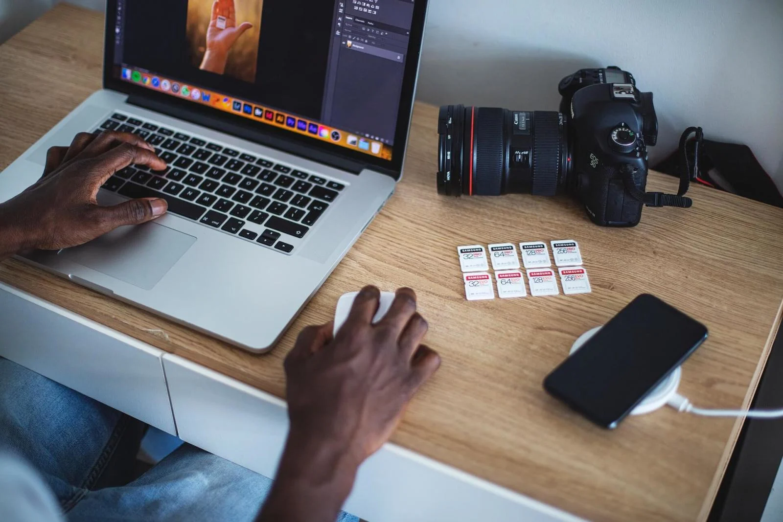 Professional photographer transferring RAW images for post-production editing in Nairobi.