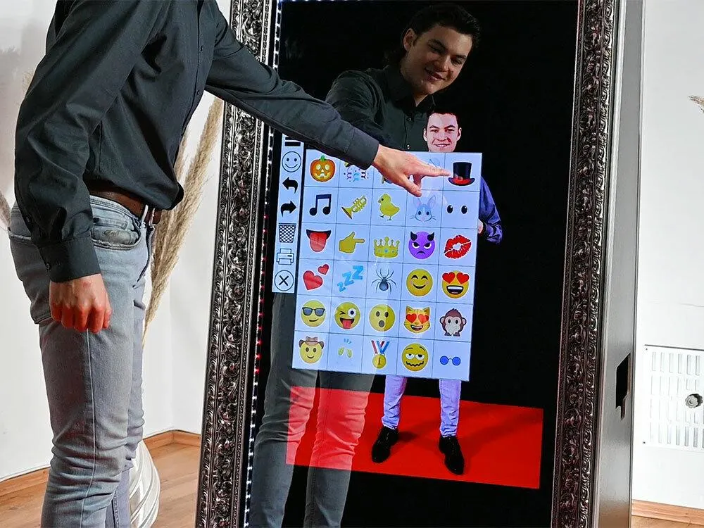 Modern mirror photo booth with touch screen interface and DSLR camera system