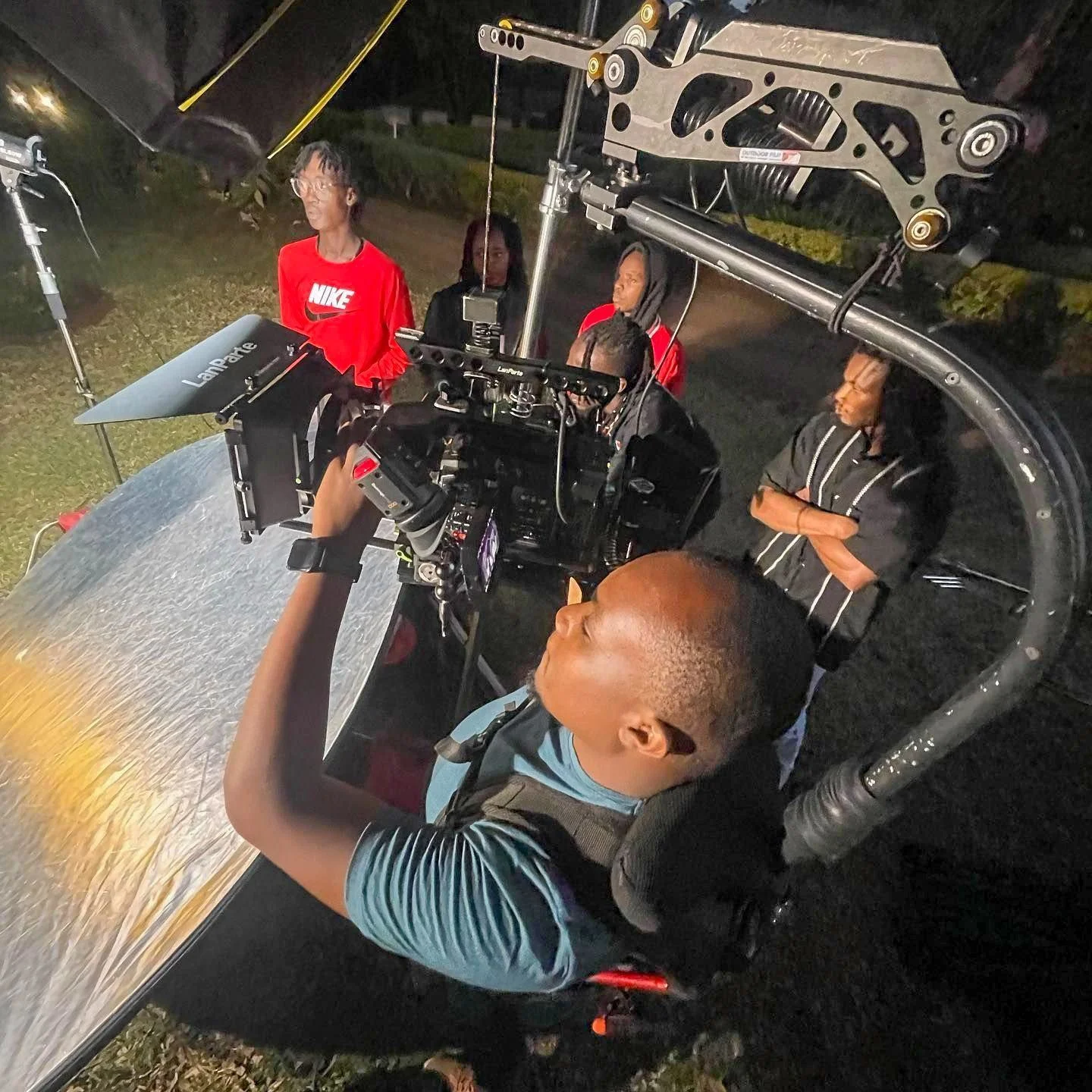 Professional videography crew filming a music video in Kenya using cinema cameras and LED lighting equipment.