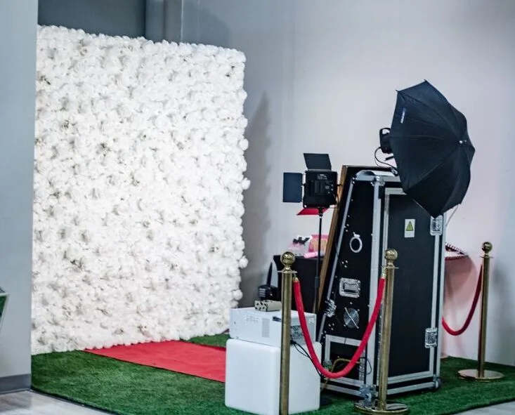 Professional photo station equipment with DSLR camera studio lighting and touchscreen kiosk