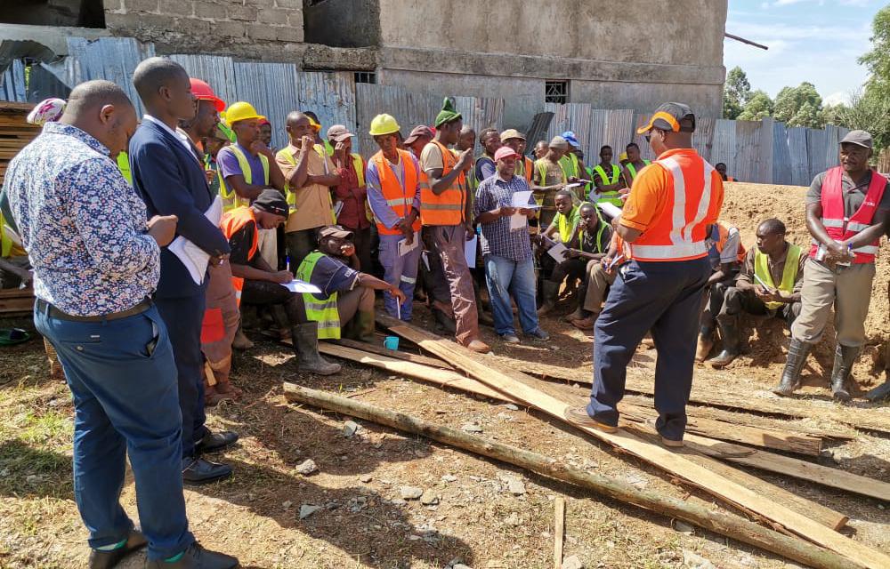 Image of industrial workers gathered together