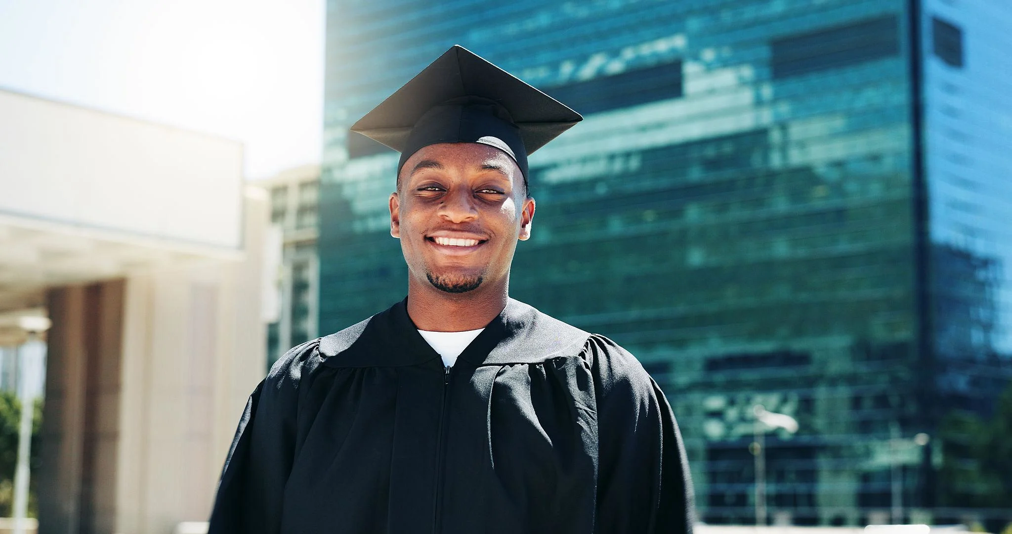 Graduation portrait taken at a university landmark in Nairobi Kenya