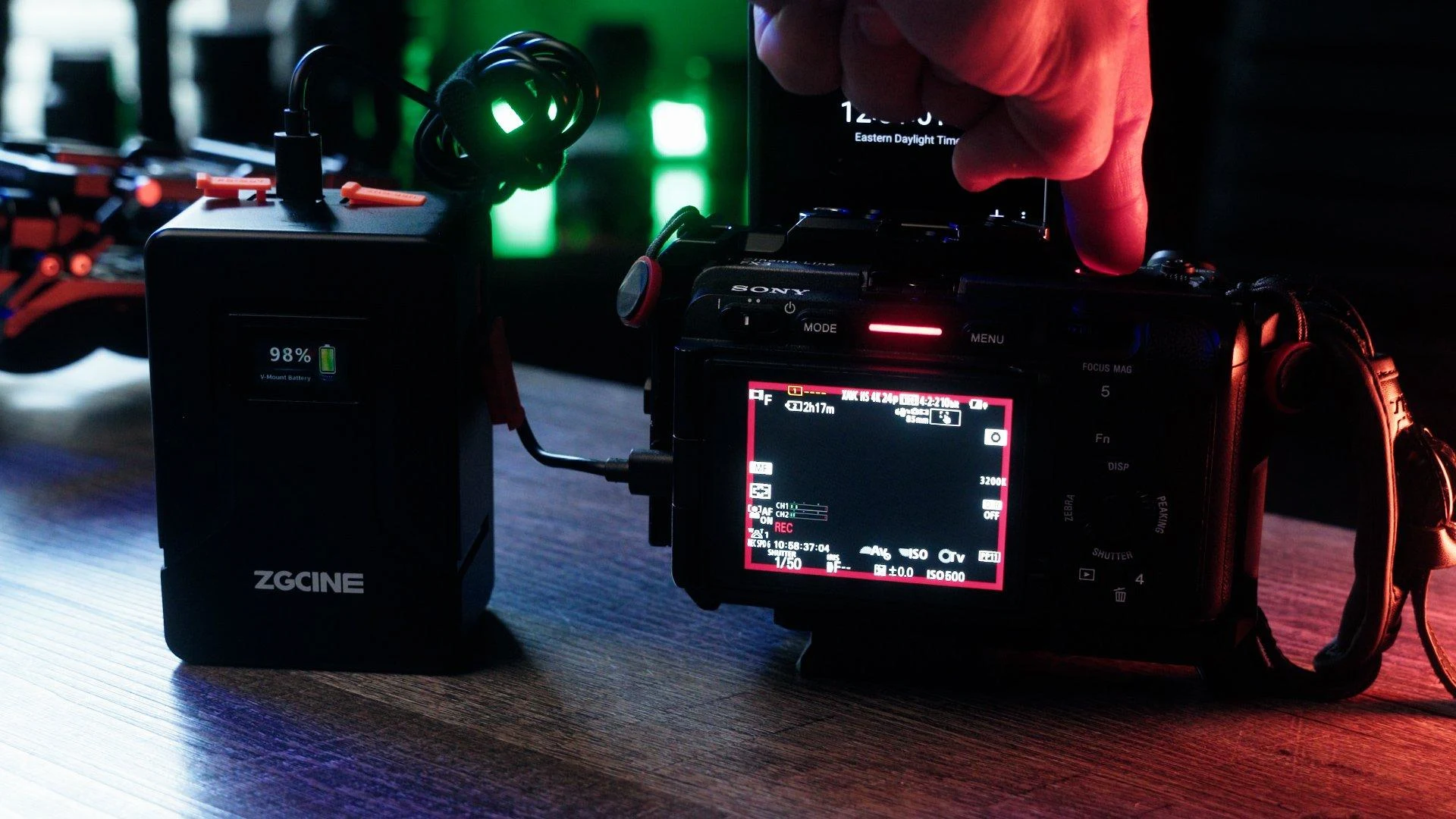 Professional V-mount batteries powering cinema cameras during video production