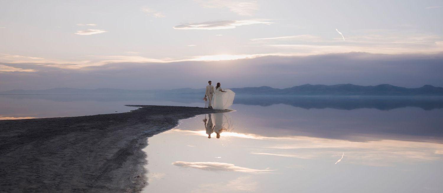 image of a couple photography in a lake with mirror reflections